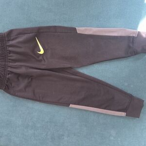 Nike Kids Black Joggers with Yellow Swoosh